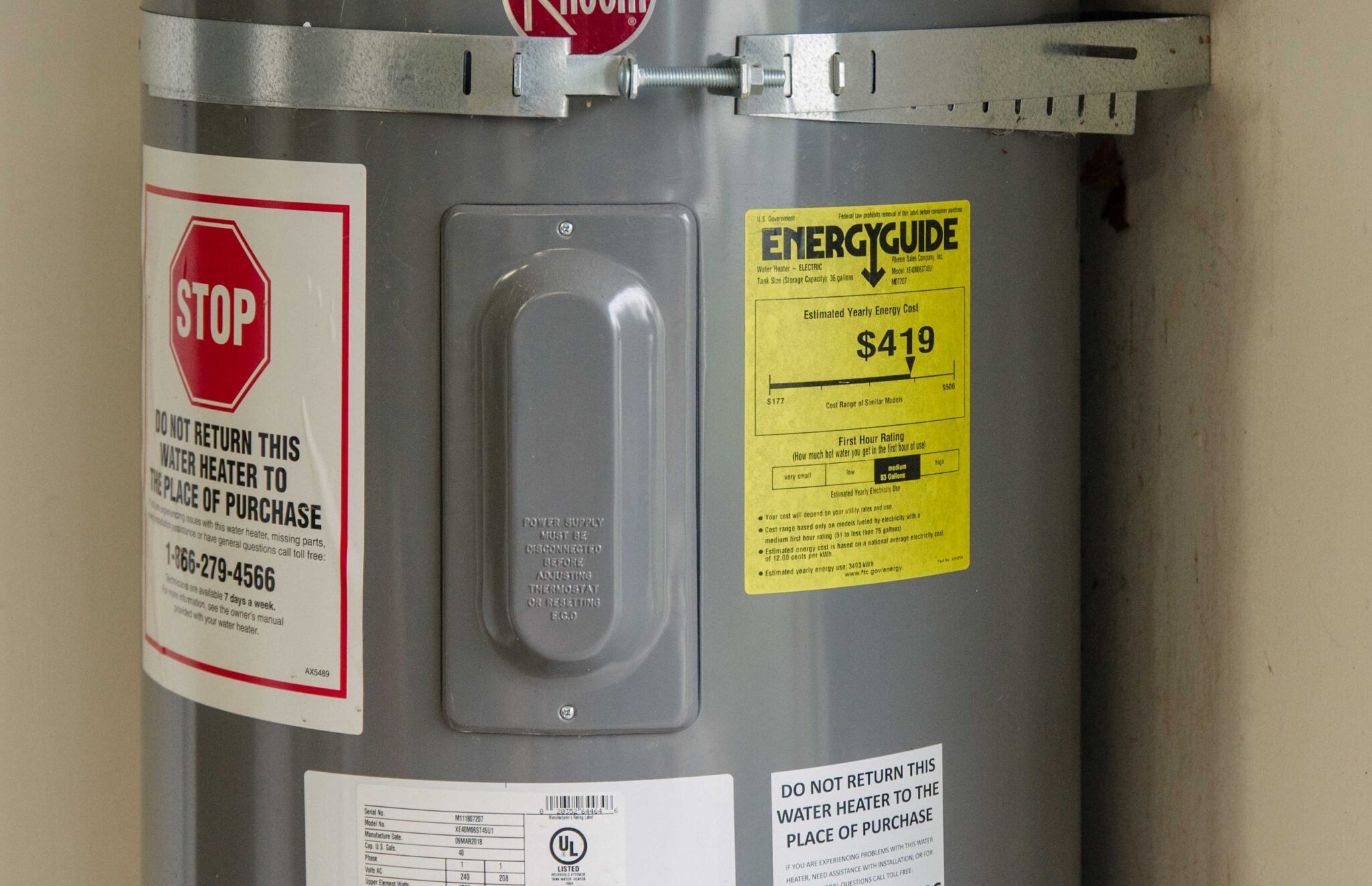 Water heater with an EnergyGuide sticker showing an estimated yearly cost of $419