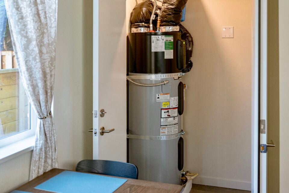Ducted heat pump water heater in a closet