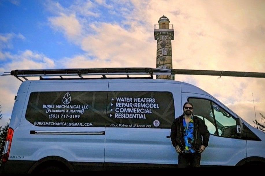 Pete Burks in front of his work van